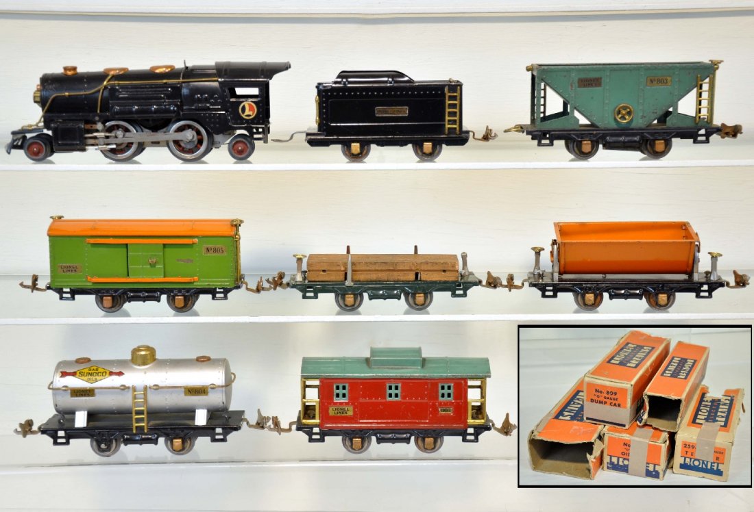 8Pc Lionel 259E Steam Freight Set: Includes a clean 1934 #259E steam loco; 259T tender, ob; 831 lumber car, ob; 803 hopper; 805 boxcar; 804 Sunoco tank car, ob; 809 tipple dump, nice lettering, ob; 807 caboose, ob. All are clean & shin