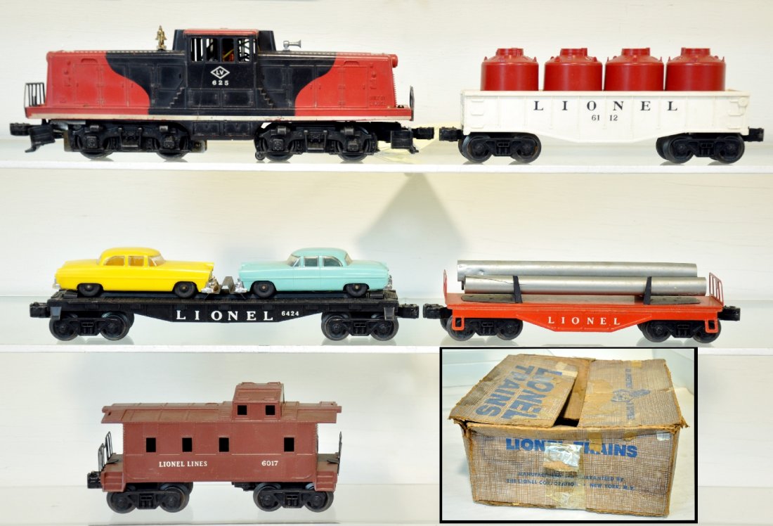 Boxed Lionel 625 Diesel Set 1571: Circa 1958. Includes a 625 LV 44 Ton diesel, screw chip; 6121 flat with pipes, 1 split; 6424 auto-loader; 6112 gondola with canisters; 6017 caboose. All show moderate playwear with C6+ setbox, otherwi