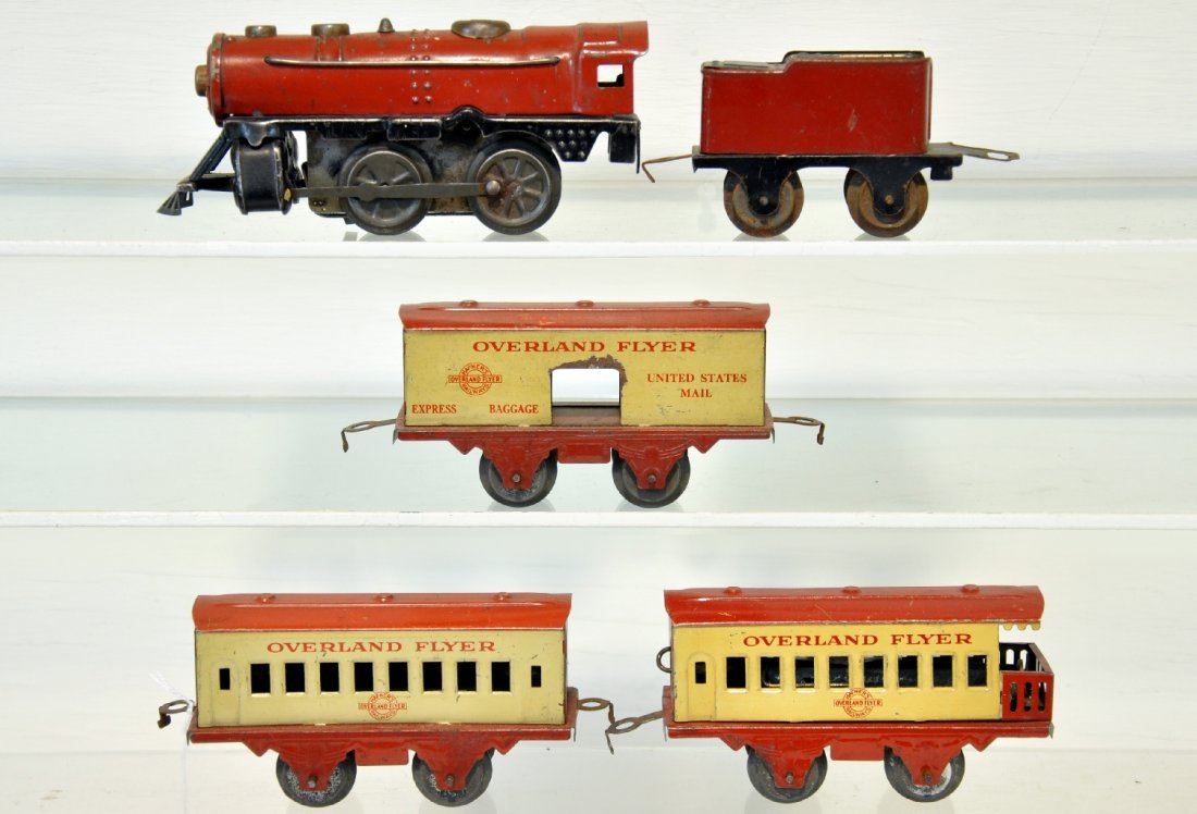 Hafner Worlds Fair Set: O Gauge. First sold at the 1933 New York World's Fair. Includes a tin loco, mechanism functional with bell; tender; Overland baggage, coach & observation with battery operated ETD. All show moderate p