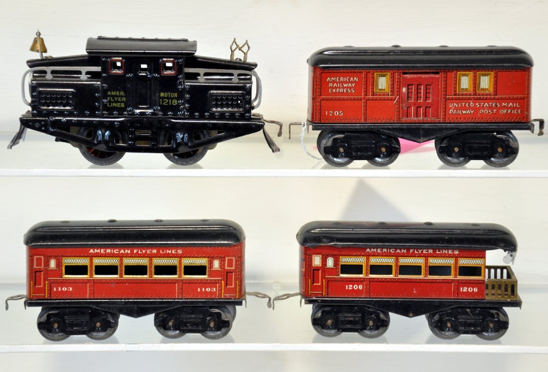 Nice American Flyer 1218 Passenger Set: O Gauge. Circa 1926. Includes a 1218 steeple cab electric, yellow rubber stamped lettering strong; 1205 baggage; 1103 coach; 1207 observation. All are clean, shiny with bright color, showing light to 