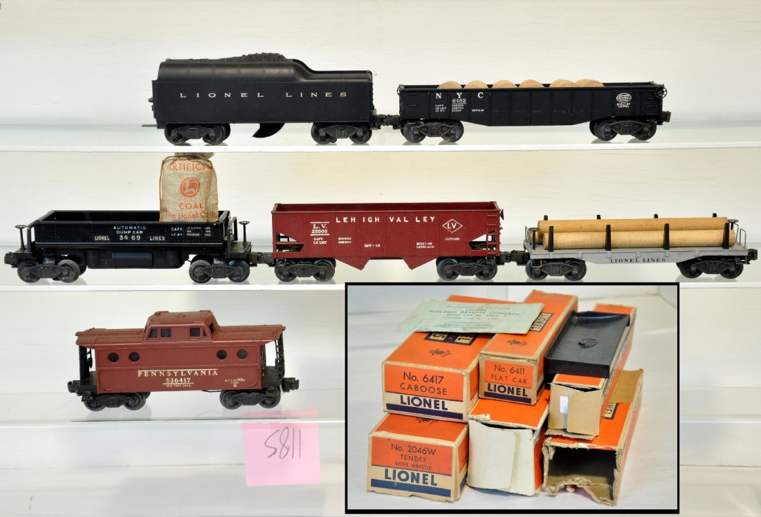 6 Boxed Lionel Freight Cars: Includes a 3469 coal dump car with 207 & bin; 6456 LV hopper; 2046W tender; 6417 N5c Caboose; 6462 NYC gondola with drums; 6411 flat with logs. All are clean, showing light to moderate playwear with b