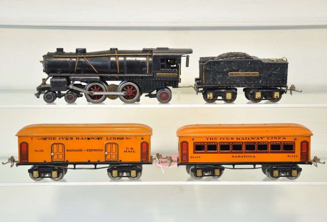 Ives 1122 Passenger Set: Includes an 1122 4-4-2 steam loco, solid castings, light missing; 1122T cast tender, body shows distortion; 131 baggage; 129 Coach. Cars are clean & shiny, C8, loco is otherwise C6