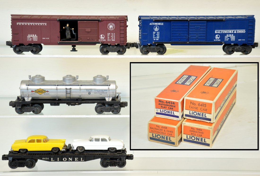 4 Boxed Lionel Freight Cars: Includes a 3484 PRR operating boxcar; 6468 B&O boxcar; 6415 tank car; 6424 auto-loader. All show light to moderate playwear with boxes, C7