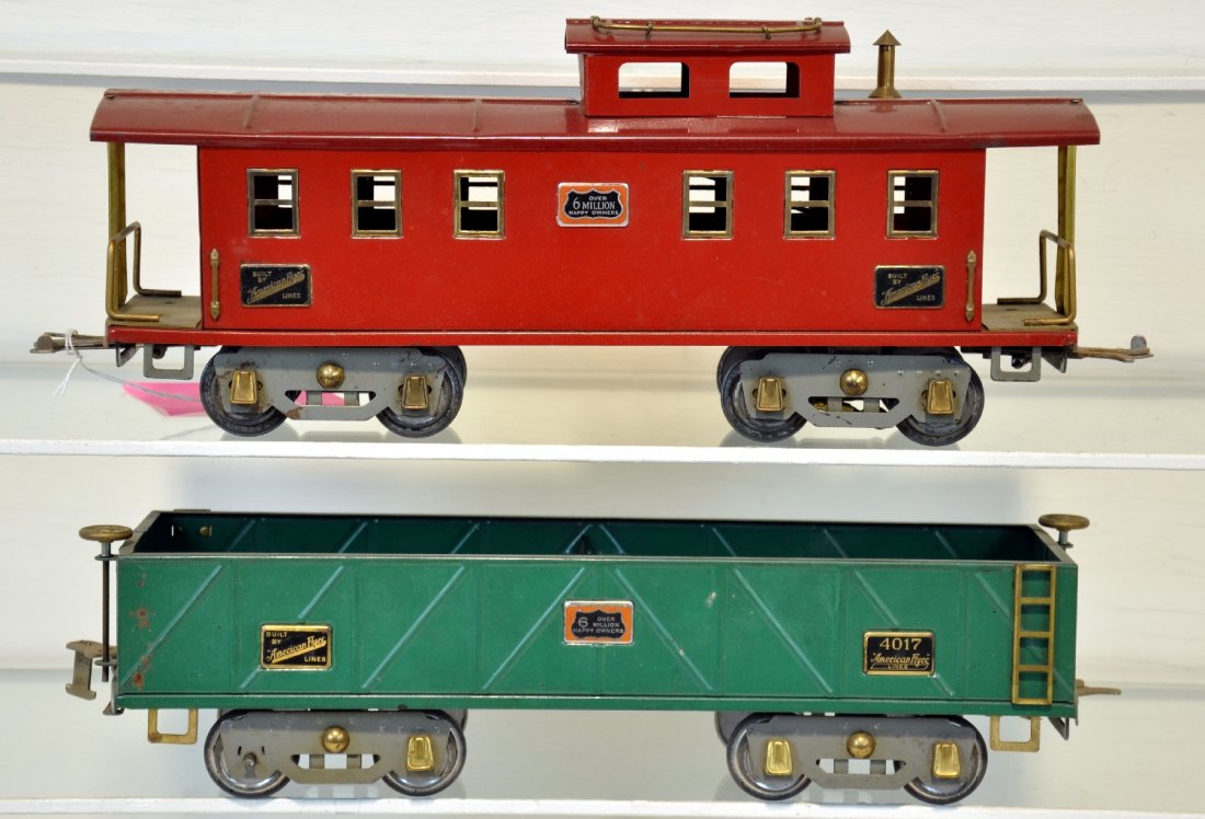 American Flyer 4017 & 4021 Freight Cars: Standard Gauge. Includes a 4017 sand car & 4021 caboose. They both have 6 mil. plates. They are fairly clean, showing moderate playwear, C6