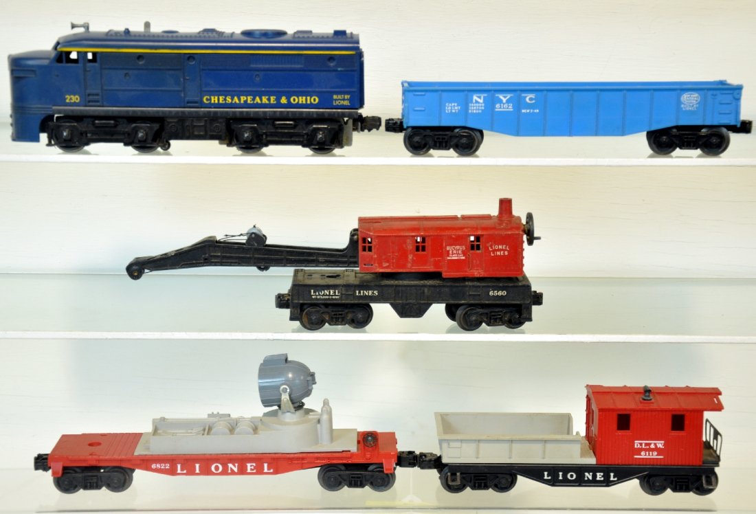 5Pc Lionel 230 Diesel Freight Set: Includes a 230 C&O Alco diesel; 6162 gondola; 6560 crane; 6822 searchlight, missing lens; 6119-100 work caboose. All show light to moderate playwear, C7
