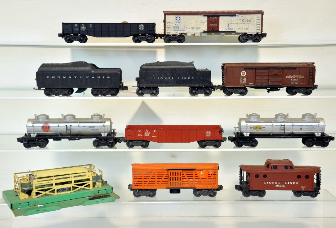 10Pc Lionel Lot: Includes a 2671W PRR tender; 6466W tender; 3656 Cattle car with pen, no cows or ramp; 6672 reefer; 2 #6462 gondolas; 2 #6415 Sunoco 3d tank cars; 6427 N5c caboose; 2458 PRR boxcar. All show moderate p
