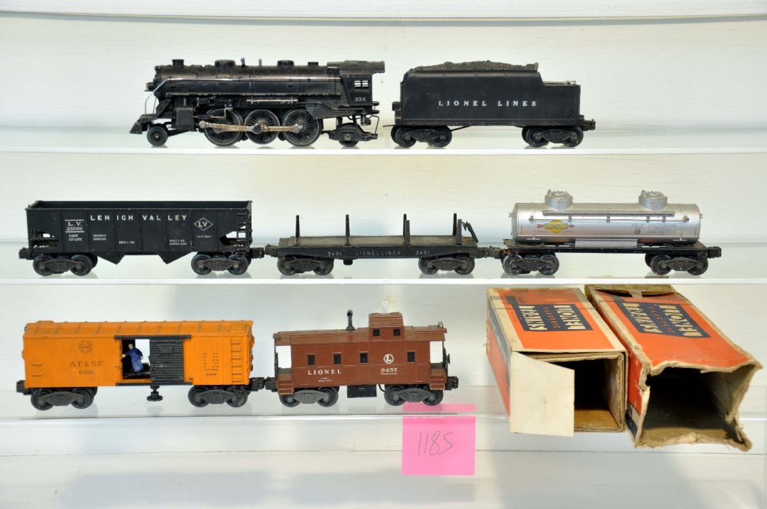 7Pc Lionel 224 Steam Freight Set: Includes a 224 steam loco, no E-Unit, rough ob; 2466WX tender, rough ob; 2456 LV hopper; 3451 lumber car, no load; 2465 tank car; 3464 NYC operating boxcar, repro figure; 6457 caboose. All show modera