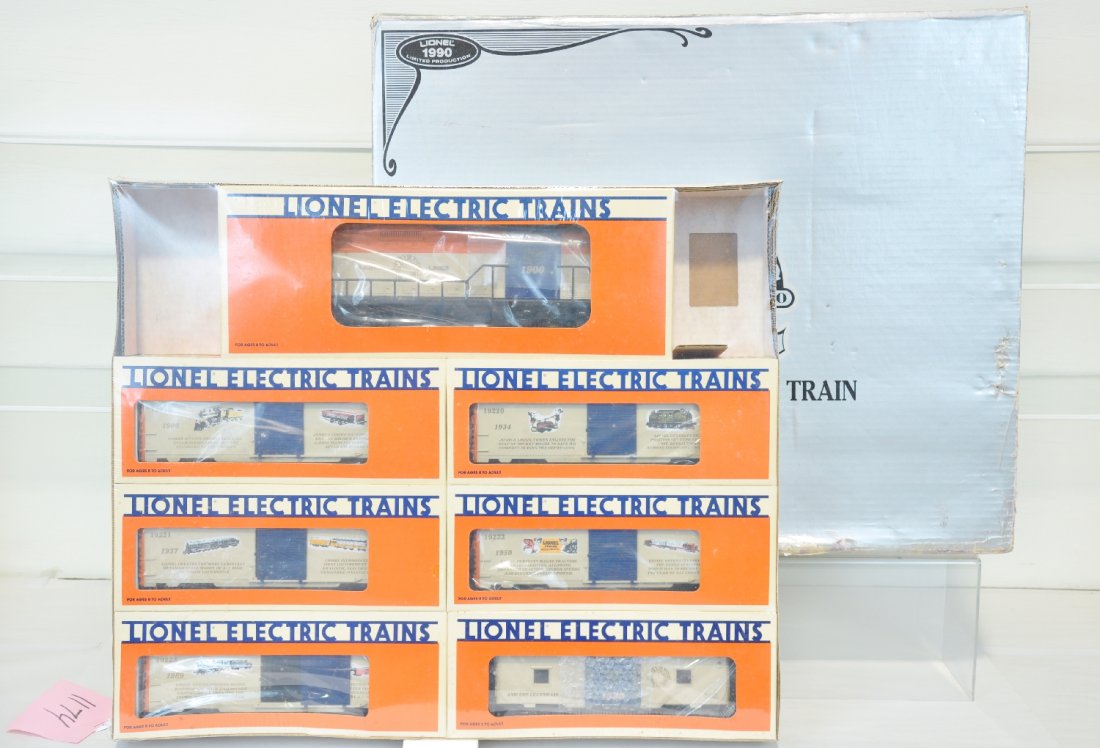 Lionel 75th Anniversary Train 11715: Train includes GP-9 and 6 Boxcars. Set is sealed in original box. Ob has moderate shelving wear around edges. Trains C10