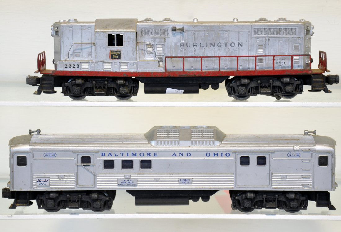 Lionel 404 & 2328 Diesels: Includes a 404 RDC-4 Budd diesel & 2328 Burlington GP7 diesel. Both have clean battery boxes and show moderate to heavy playwear, C5-6