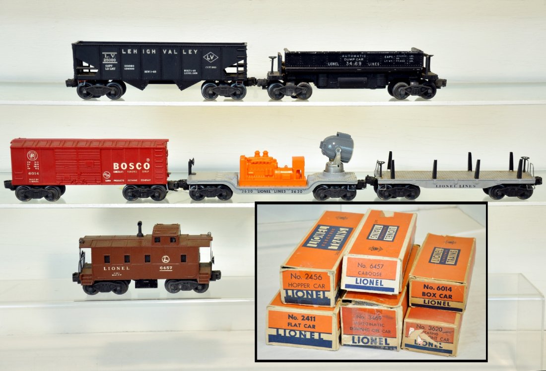 6 Boxed Lionel Train Cars: 2411 flat, no load; 2456 hopper; 3469 coal dump car; 6014 Bosco boxcar; 3620 searchlight car; 6457 caboose. All show moderate playwear with boxes, C6