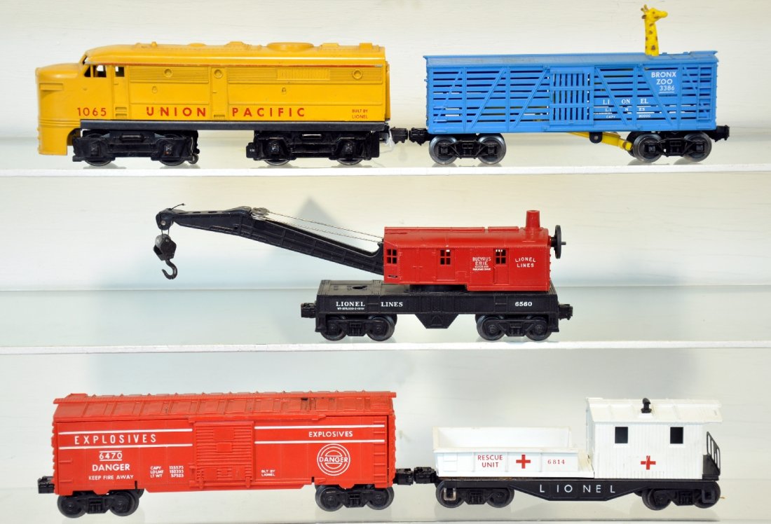 Late 5Pc Lionel 1065 Freight Set: Includes an uncataloged 1065 UP Alco A diesel; 3386 giraffe car, no accessories; 6560 crane; 6470 target car, no pin or grommet; 6814 JC Penny rescue caboose with black frame. All show light to modera
