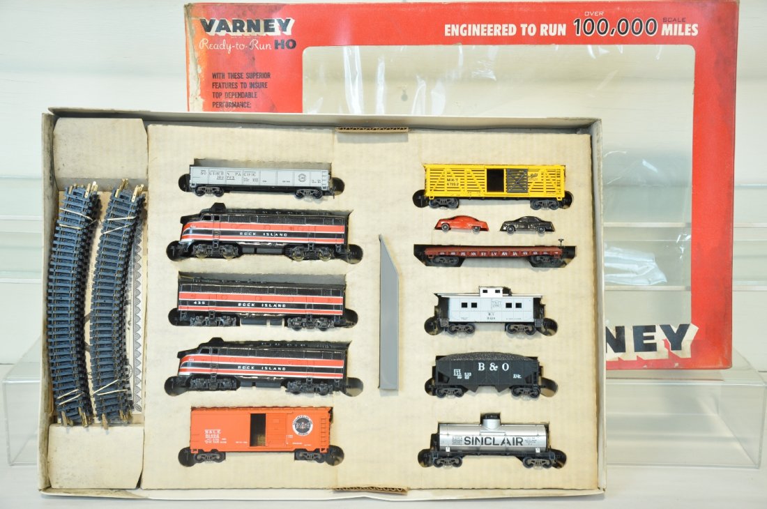 Scarce Early Varney HO PRR Golden Eagle Set: #2807PRR. Includes RI F7 ABA diesels; gondola, boxcar; stock car; auto-loader; hopper; tank car & caboose, all appear new in display box with track, setbox top has mildew stains, trains are C9