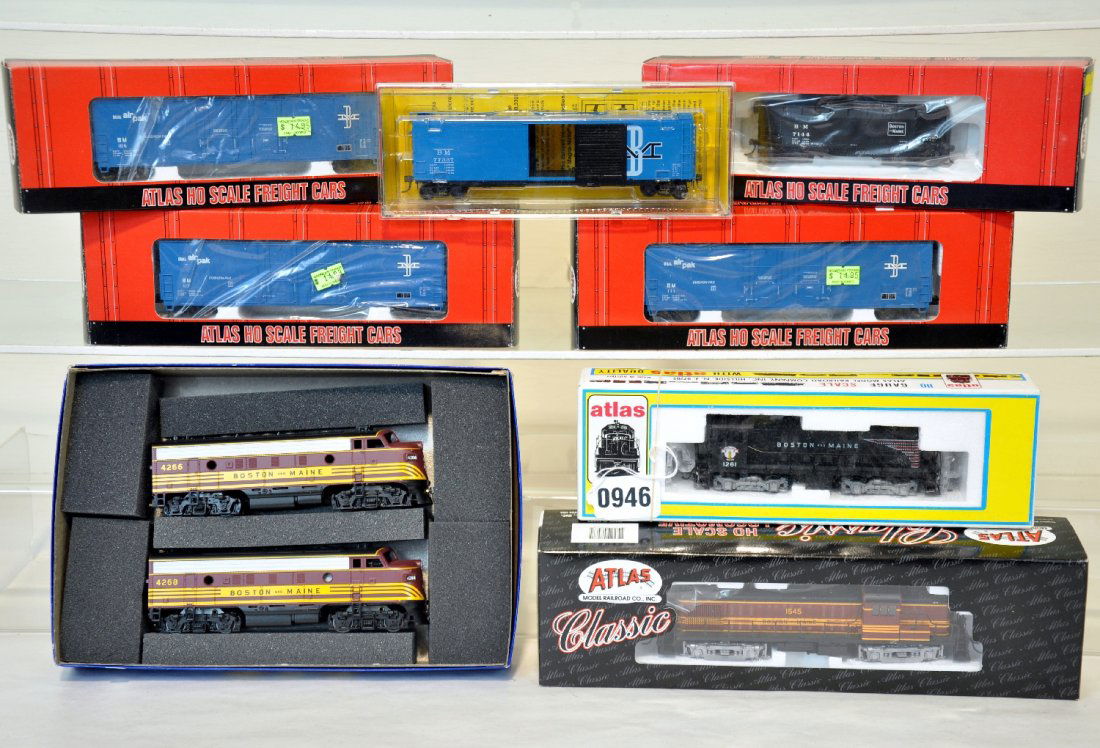 8Pc Boxed HO Trains Group: Includes an Athearn SE series B&M F7AA diesels (cab 4266/4268); Atlas 8468 B&M RS3 diesel, cab 1545; Atlas 8087 B&M S2 diesel, cab 1261; 3 Atlas Evans plug door boxcars; Atlas B&M Offset hopper & a Ka