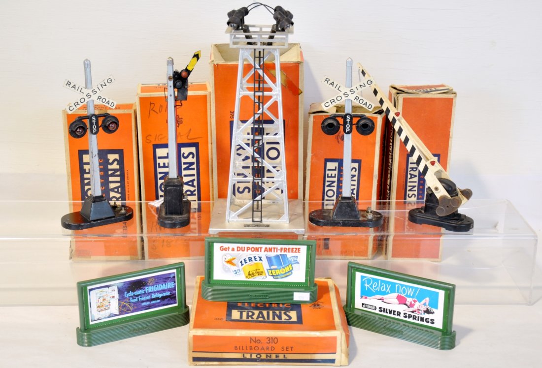 7 Boxed Lionel Accessories: Includes 2 #151 semaphores, 2 early 154 flashers; 252 crossing gate, light oxidation on counter weights; 395 aluminum light tower; partial 310 billboard set, many boards, 3 frames. All show light to m