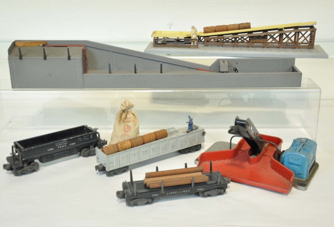 Lionel Accessories: Includes a 362 barrel ramp, missing flapper, with a 3562-25 barrel car; 364 crackle lumber loader, replaced corner guide, with a 3461 lumber car; 397 coal loader, needs belt & shield; with a 3469 coal
