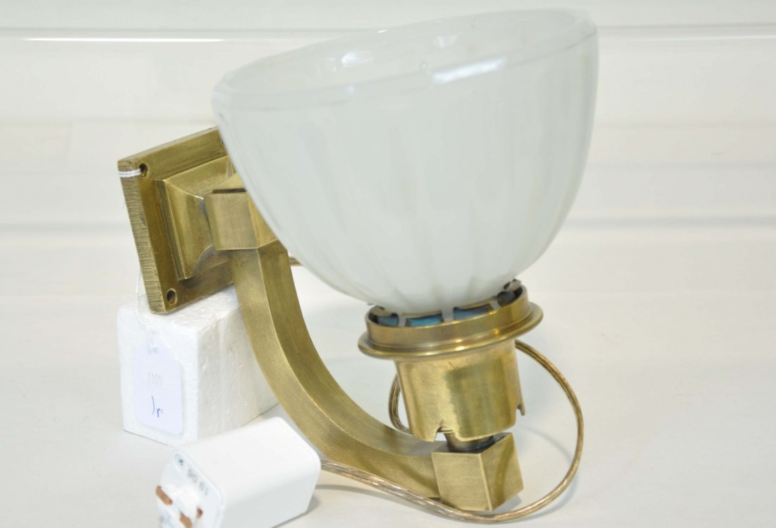 Nice Art Deco Pullman Light: Circa 1930s. Cast brass with 6 1/2" lightly-opalescent glass shade, electric with functional early nipple topped 3-element bulb. Bracket marked #51297. Nice condition. Was functional at consignor's ho