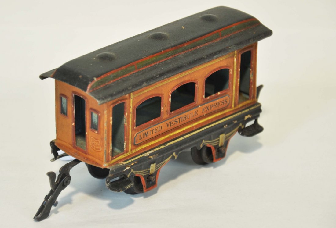 Marklin Limited Vestibule Express Coach: Scarce 5 inch coach hand painted with stamped lettering with beautiful bright patina. Circa 1910's. Shows light to moderate playwear C6+-7