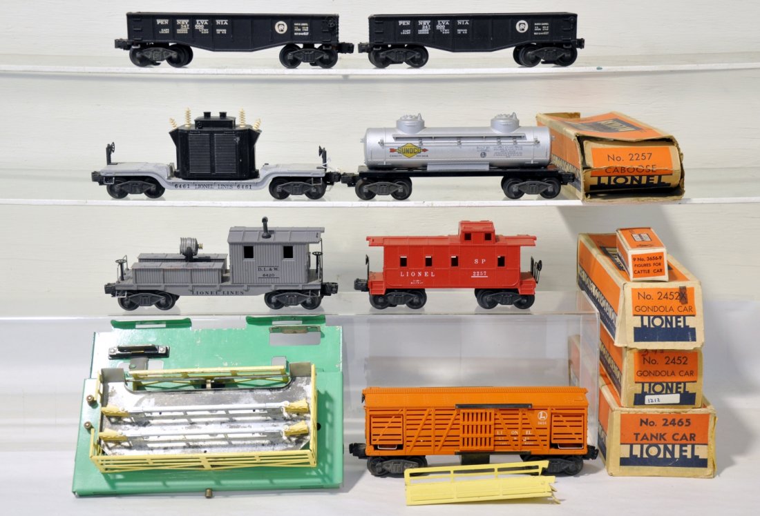 7 Lionel Freight Cars, 4 Boxed: Includes a 2420 searchlight work caboose, some edge wear on tool boxes; 6465 tank car, 2465 ob; 2 #2452 gondolas, 1 flying shoe trucks with 2 whirly wheel sets, 1 ob; 2257 caboose, worn ob; 3656 stock