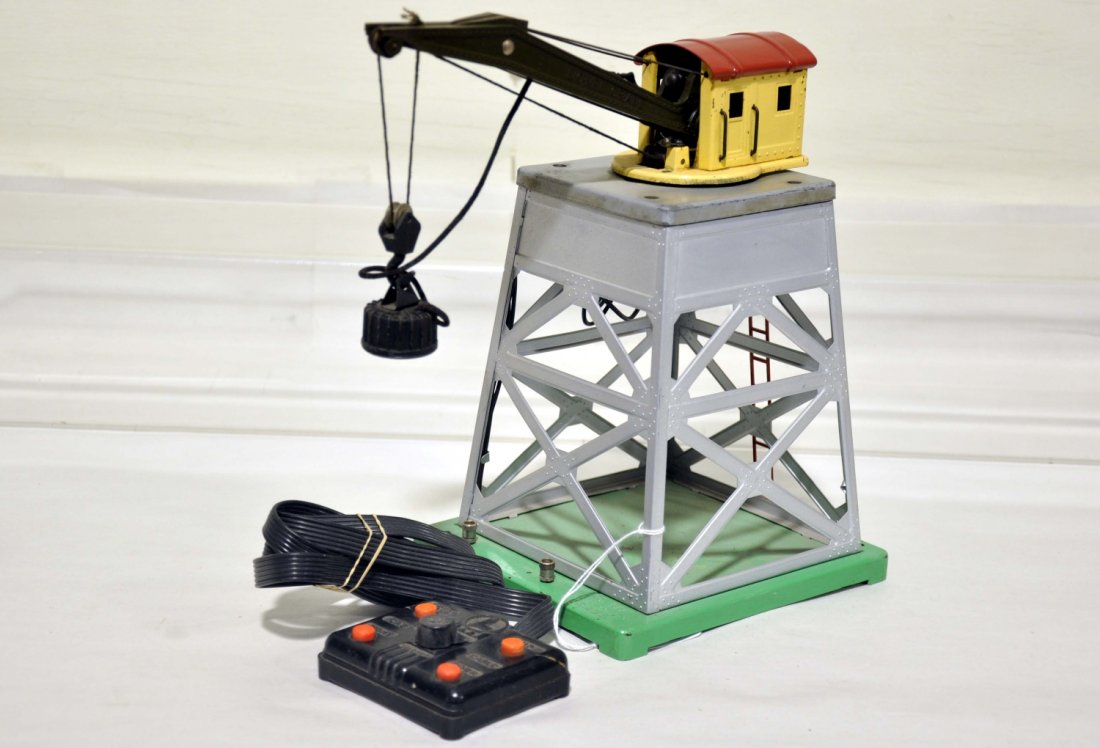 Clean Lionel 165 Magnetic Crane: Clean with silver superstructure. Controller rewired and ready to run. It shows light to moderate playwear, C6+