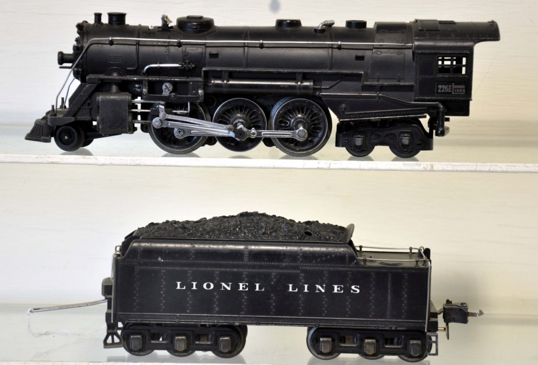 Lionel 226E Hudson Locomotive: Matte patina with bright nickel trim; matching 2226W cast whistling tender with high box couplers. It shows light to moderate playwear, C7