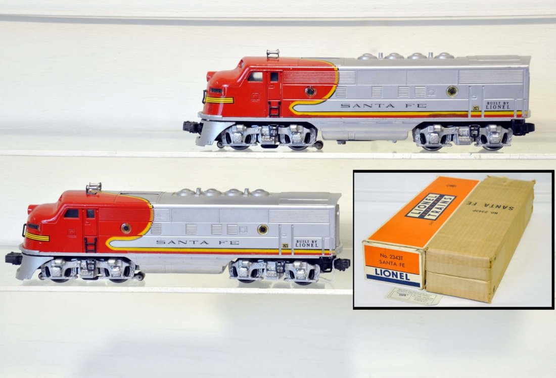 Clean Boxed Lionel 2343 SF F3 AA Diesels: Nice matched pair with decal chips at doors. The silver is better than most and the battery box is clean. They have C6 boxes with inserts and show light to moderate playwear, otherwise C7