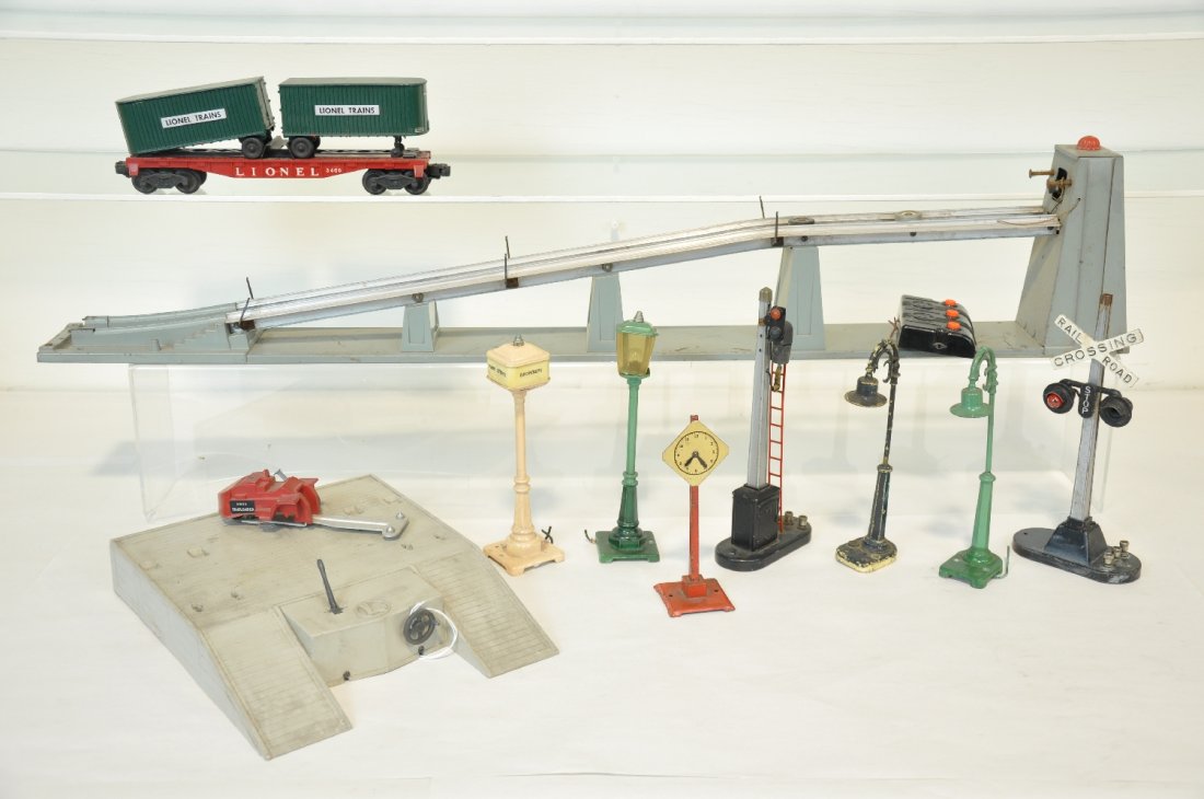 Lionel Accessory Lot: Includes a 456 coal ramp with controller; 460 piggy-back platform set; 154 flasher; 58 lamppost; 57 Broadway lamppost; 151 semaphore; 56 lamppost; 1672 clock; 59 lamppost; all have some issues, so exa