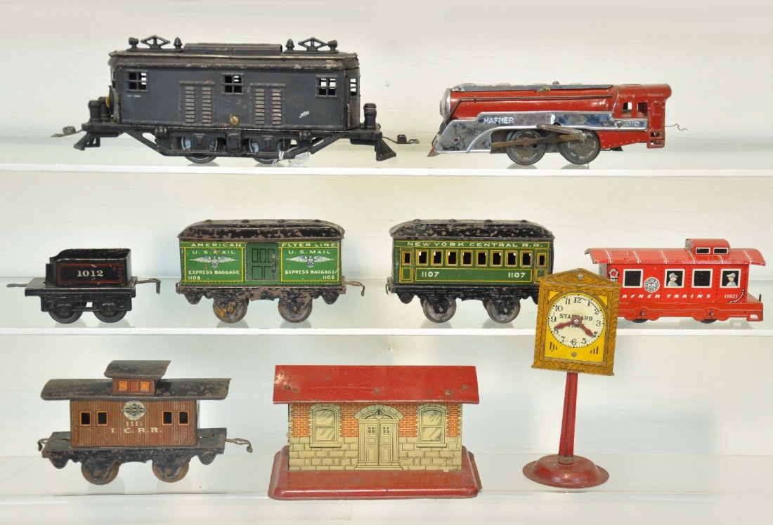 American Flyer & Hafner Lot: Includes a 3115 boxcab electric, repainted; clock; 1114 IC caboose; 1108 baggage; Glen Ellyn station; Bing 1012 tender; Hafner 1010 loco & caboose. Condition varies C4-6, so examine photos closely