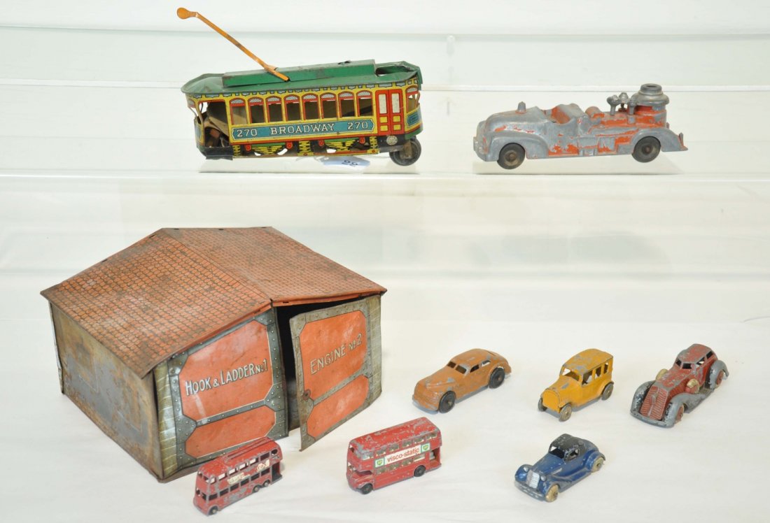 9Pc Vintage Toy Lot: Includes early TootsieToy sedan C5, Manoil roadster C3, It’s a beauty sedan C5, TootsieToy coupe 2-tone C5, Hubley pumper C2, 2 Matchbox buses C2, Bing fire station garage, no vehicle, C4, Chein Bro