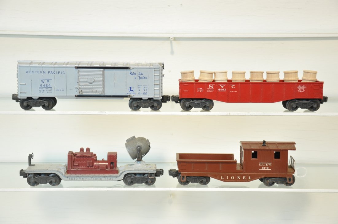 4 Lionel Freight Cars: Includes a 6520 searchlight car; 6462-125 gondola with repro drums; 6464-1 WP boxcar, type I; 6119-75 work caboose. All show moderate playwear, C6-6+