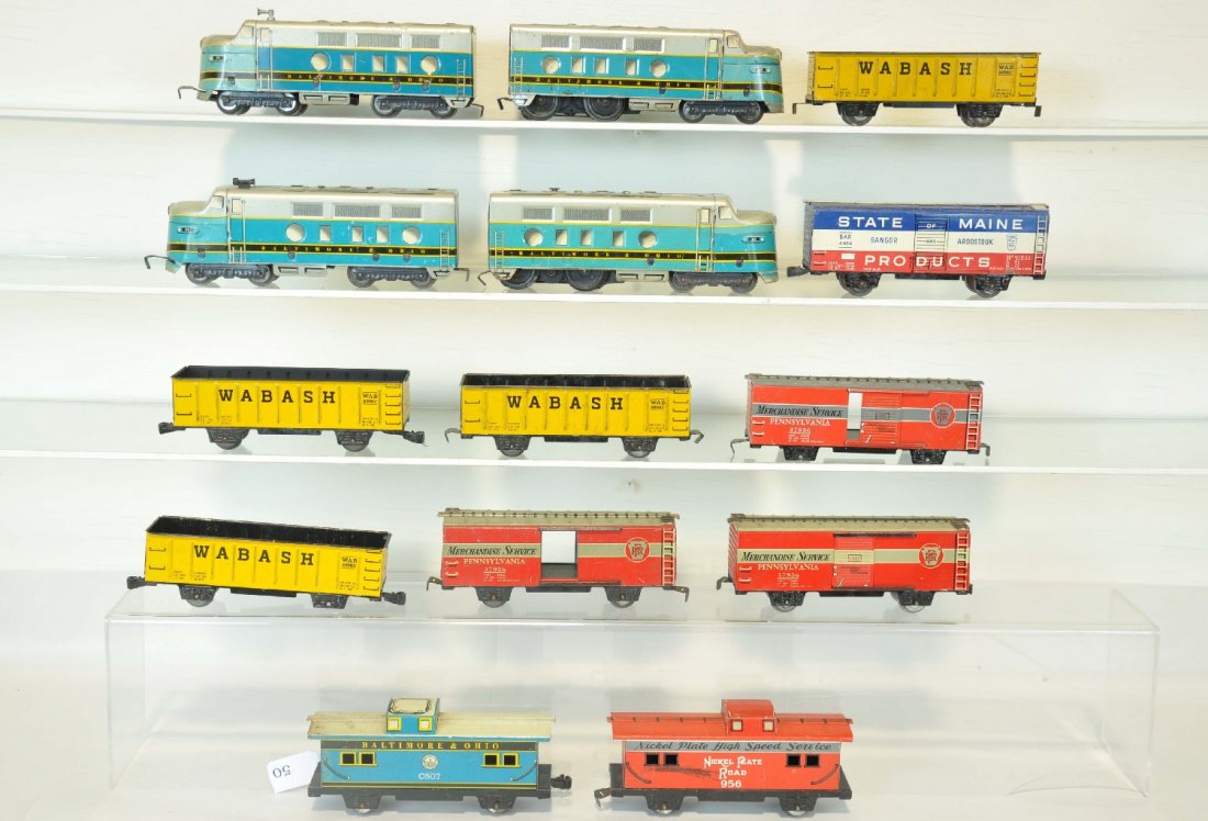 Marx B&O Diesel Freight Pieces: Includes two 62 B&O F7 AA Diesels with 2 horns; 1 matching caboose and 9 assorted 7" tin freight cars. All show moderate playwear, C6