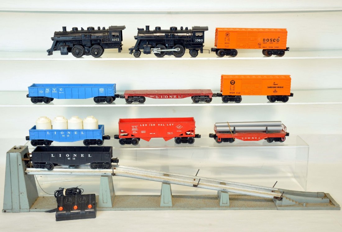 11Pc Lionel Lot: Includes a 456 coal ramp with controller, incomplete; 1060 loco; 6112 gondola; 1062 loco, needs parts; 6112 gondola with canisters; 6476 hopper; 6024 Shredded Wheat boxcar; 6121 flat with repro pipes;