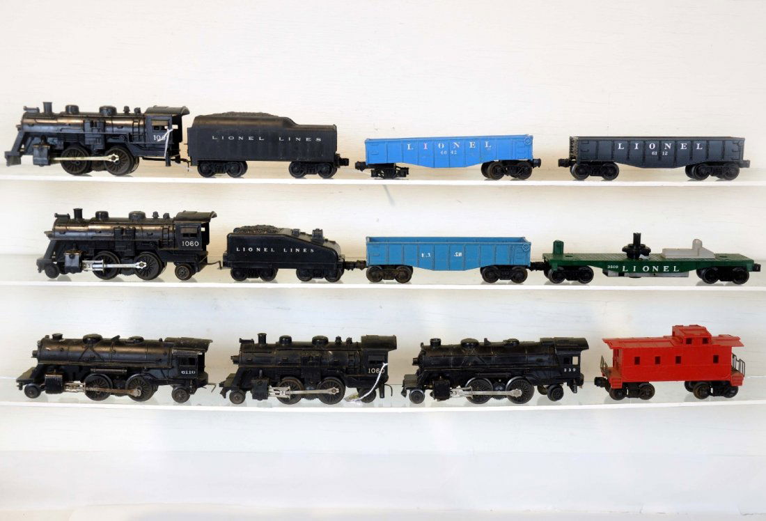 12Pc Assorted Lionel Trains: Includes 2 #1060 2-4-2 locos; 6110 scout loco; 1061 loco; 239 cast loco; 1050T tender; 1060T tender; 2 #6042 gondolas, 1 repainted; (6067) caboose; 3519 flat only; 6112 gondola. All show moderate play