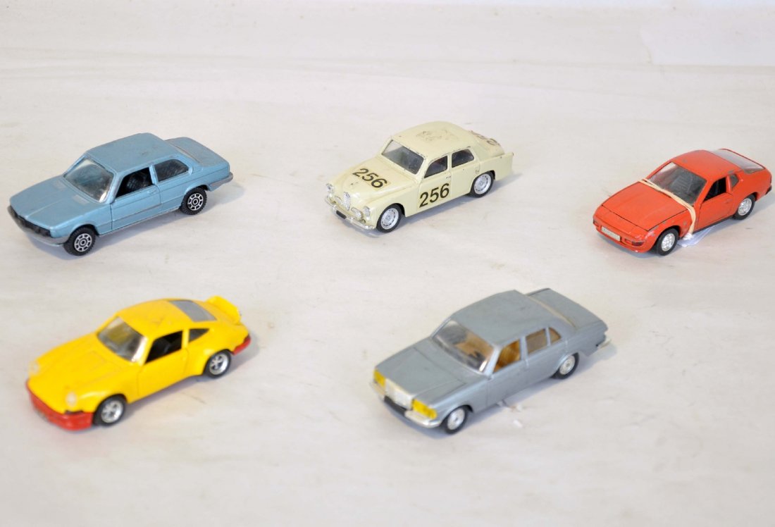 5 Assorted Vintage Diecast Vehicles: Includes a Solido Mercedes 260E, missing rear brake light; Solido Porsche Carrera; Mercury BMW 320; Brumm Saab, missing rear bumper; Schuco Porsche. All otherwise show moderate playwear, C6-7