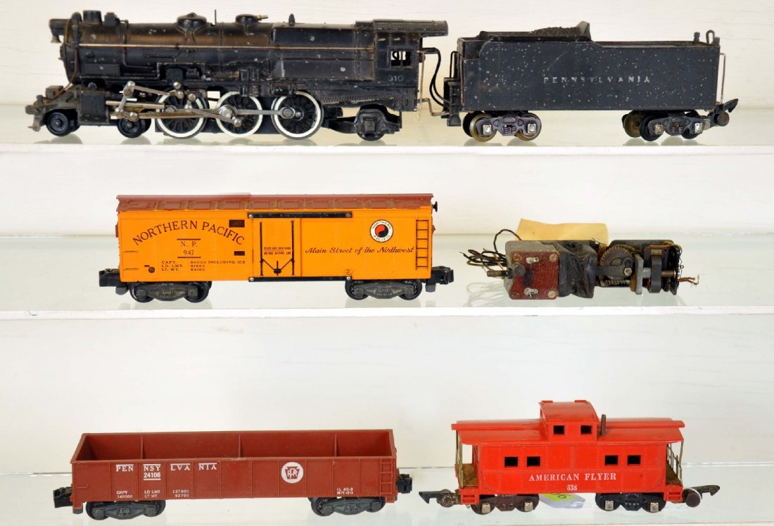 5Pc American Flyer 310 Freight Set: S Gauge. Includes a 310- PRR K4, reverse & smoke unit loose, C5; 24106 PRR gondola; 947 NP reefer; 638 caboose. All show moderate playwear, otherwise C6+