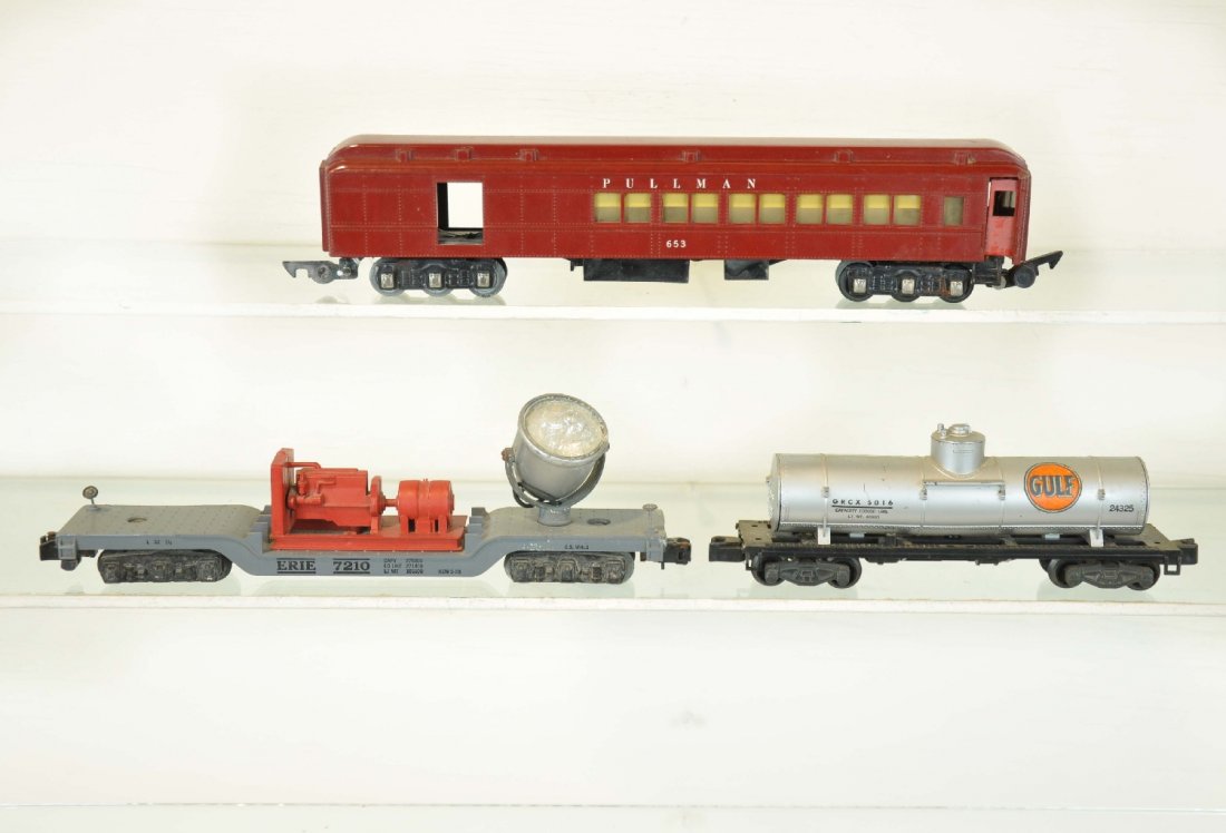 3 American Flyer Cars: S Gauge. Includes a 653 Combine, missing baggage door; 936 searchlight car, corrosion spot 1 corner; 24325 Gulf tank car, no handrails. Otherwise all are clean, shooing light to moderate playwear, C6-