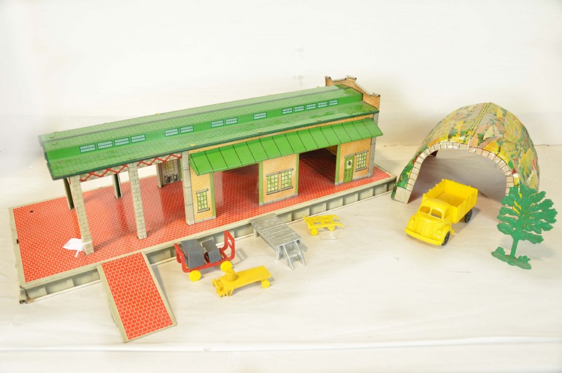 Marx Freight Station & Tunnel: Includes a large Marx litho tin freight station with several correct accessories and a clean tin tunnel. They show light to moderate playwear, small plastic platform is over-painted, otherwise C7