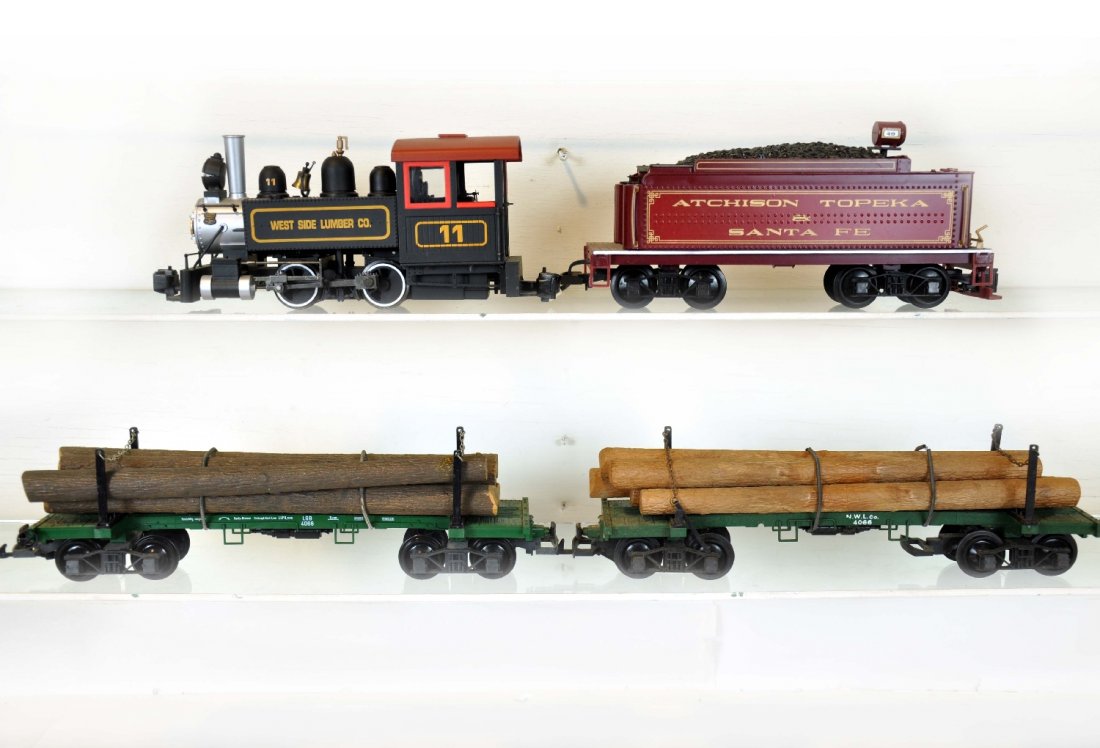 4Pc Bachmann G Gauge Lot: Includes a West Side lumber tank locomotive; AT&SF tender; 2 Log flat cars, 1 broken stake. All show light to moderate playwear, otherwise C7
