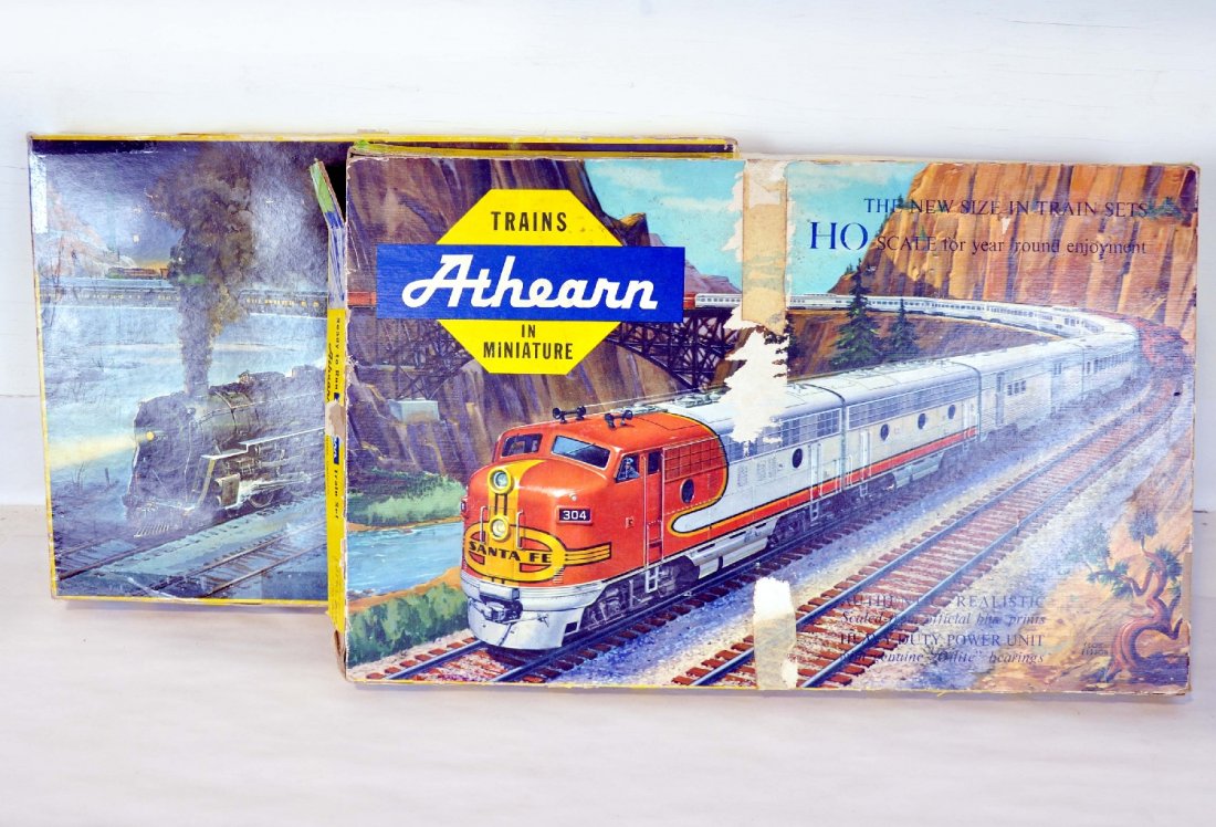 2 Boxed Early Athearn HO Train Sets: Includes a 6260 set with PRR 0-6-0 steam loco & tender with 5 freight cars and track, insert & taped setbox, C9 condition; Set 4120-39SF F7 diesel with 6 freight cars & track, some step issues with tr
