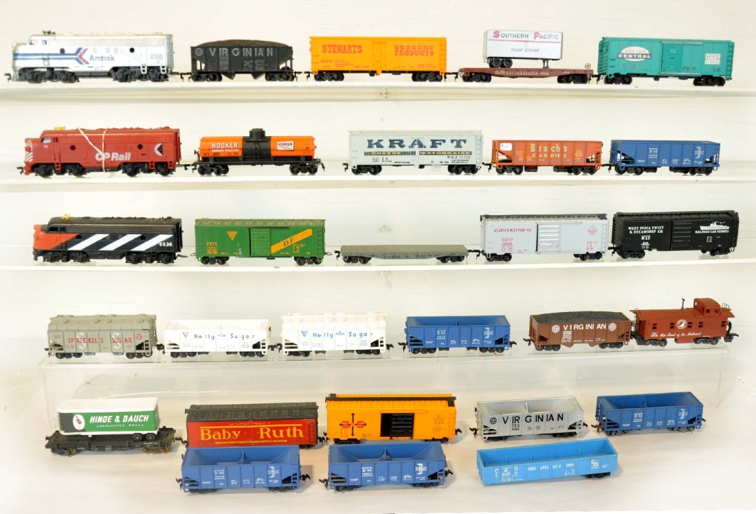 30Pc HO Trains Lot: Includes a Tyco/Mantua CN F7 diesel; CP Rail F7 Diesel; Amtrak diesel with 27 assorted freight cars, most are Mantua & Varney. They show light over-all playwear, C7-7+