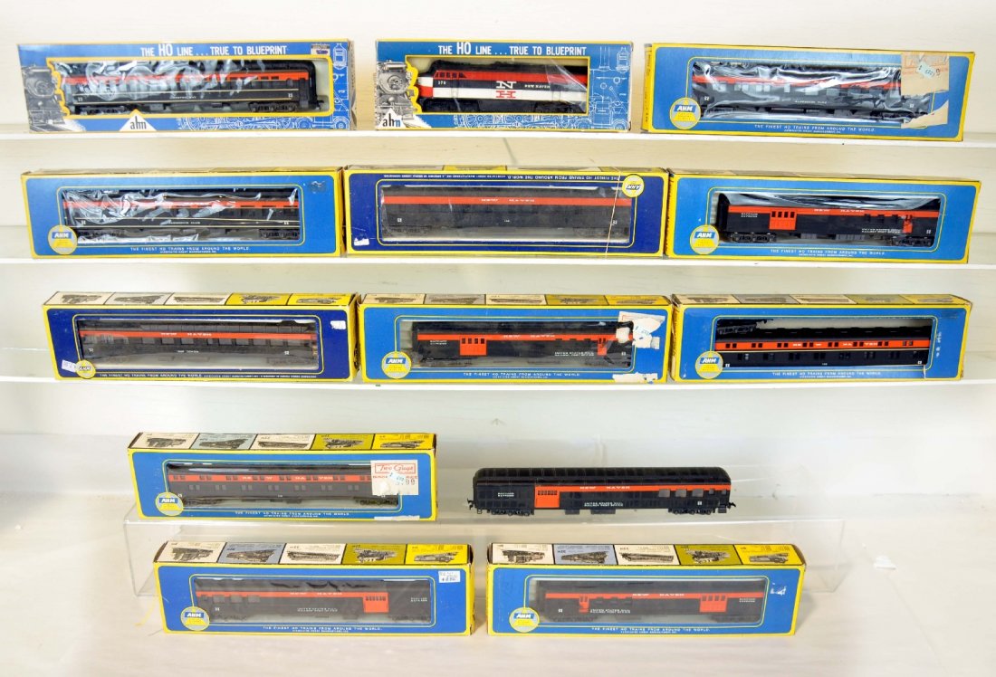 13Pc AHM HO New Haven Passenger Set: Made by RivaRossi. Includes an FM C-Liner diesel; 3 baggage/RPO; 2 Combines, 1 ob; 2 Diners; 2 coaches; 2 Diners; 2 duplex sleepers; observation, all show light runtime with boxes and most inserts, C7