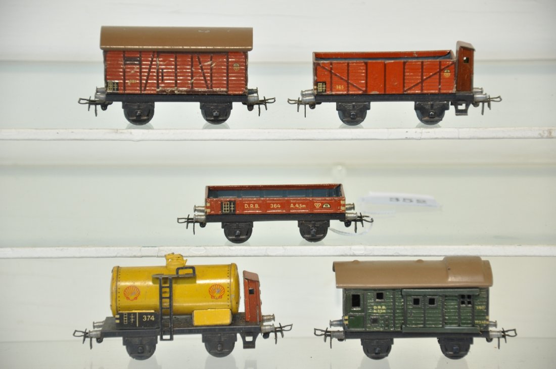 5 Earl Marklin HO Freight Cars: All circa 1955. Includes 381 goods wagon; 374 Shell tank; 390 baggage car; 365 open wagon with brake shack; 364 flat car. All are clean and show light playwear, C6+-7+