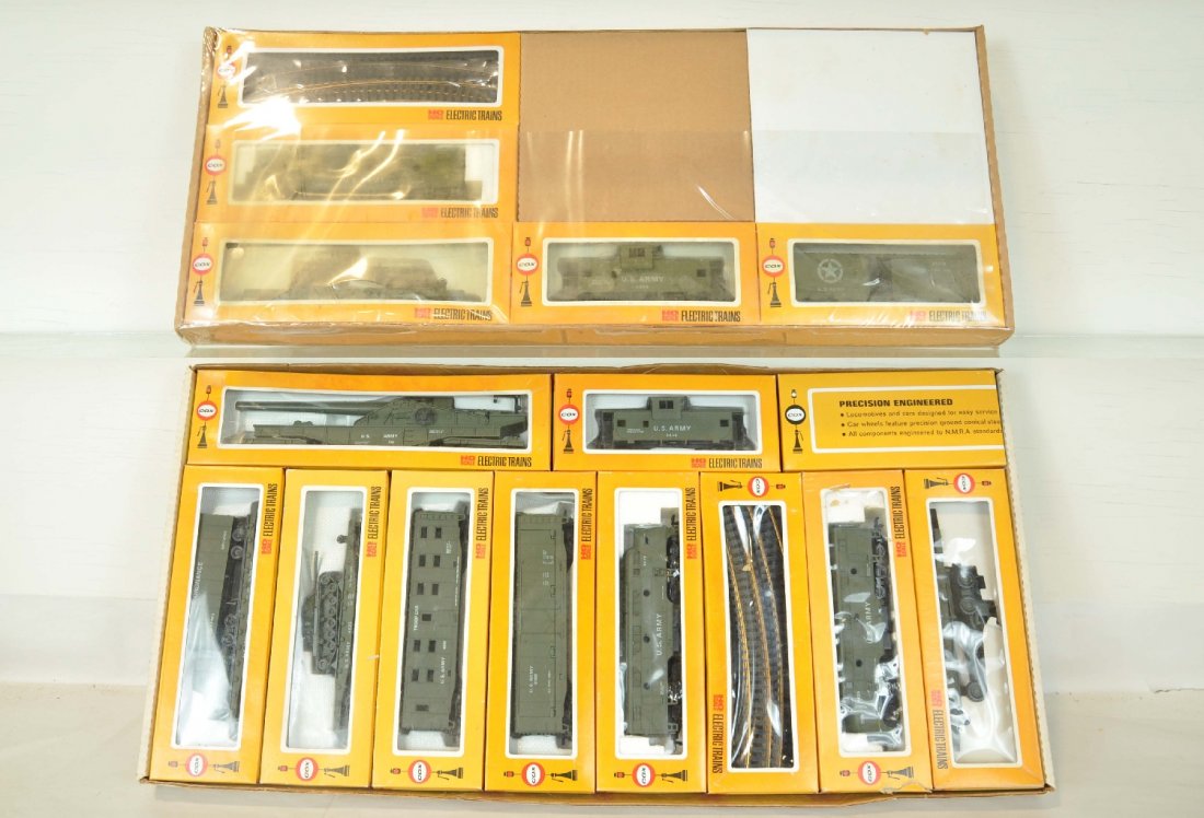 2 Cox HO Military Sets: Includes a 6071 4pc diesel set, factory sealed, setbox top is taped, C10; Deluxe GI General set, like new, boxes & setbox, top corners apart, C9