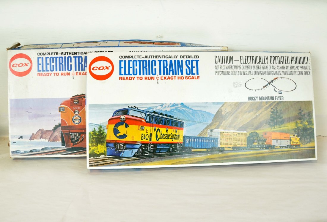 2 Cox HO Train Sets: Includes a Southern Pacific Daylight Express with PA Alco & 4 passenger cars, track & transformer with accessories, setbox has some tape, it is lightly run C8; Rocky Mountain Flyer BN F3 with 4 freigh