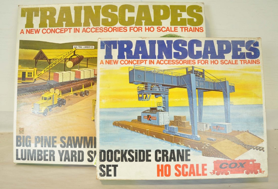 2 Cox HO Operating Accessories: Includes a dockside crane set & Big Pine sawmill and lumber yard set. They are new in boxes, C10