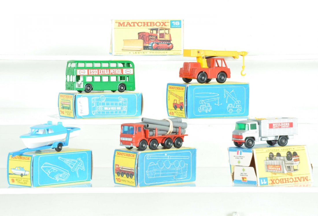 5 Boxed Matchbox Vehicles, Plus: Includes 9 boat & trailer; 10 pipe truck, ob missing 1 flap; 11 builder truck with load, ob missing 1 flap; 42 Jumbo crane; 74 D-Decker box, plus an empty 16 box. Cars show light playwear, C8-9