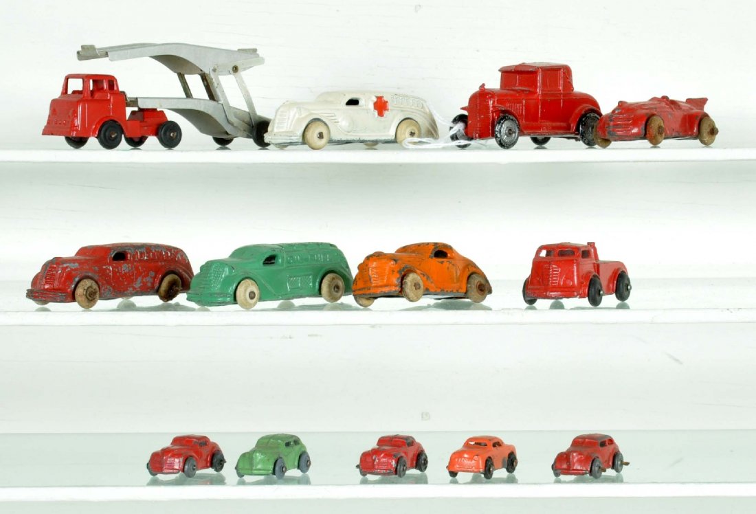Slush Vehicle Lot: Includes Barclay auto-loader with an extra car & tractor; tank truck; ambulance; delivery truck, C4; record racer; 2 coupes, orange missing 1 tire; Otherwise show moderate playwear, C6-7