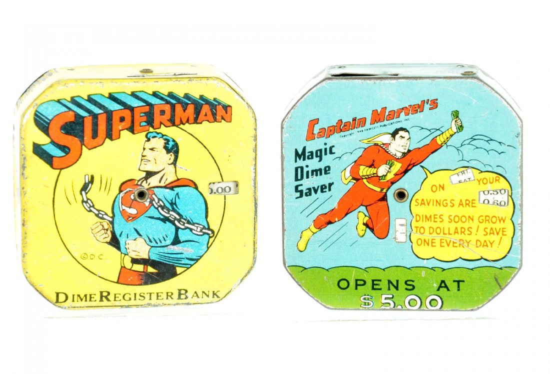 2 Super Hero Dime Register Banks: Each is 2 1/2" square, litho tin with mechanical register feature. Includes Superman & Captain Marvel. They have some coins in each, but no keys. They have their closures and show moderate playwear, s