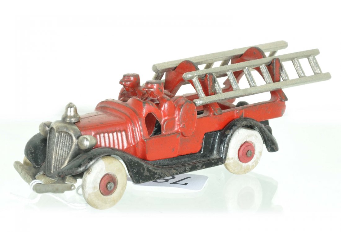 Nice Hubley Fire Ladder Truck: 6" long painted and plated cast iron with original ladders. It has white rubber tires on wood hubs and only shows light to moderate playwear, C6+
