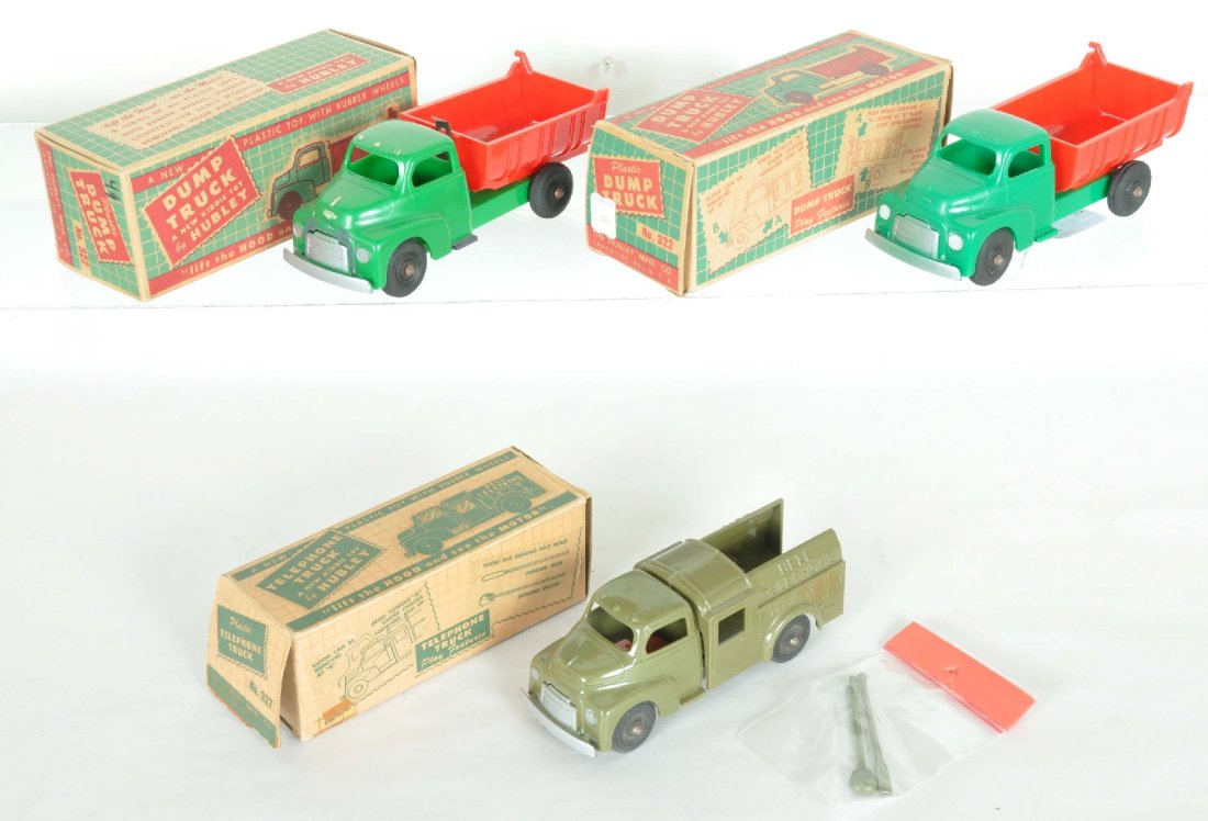 3 Boxed Hubley Trucks: Includes a 6 1/2" #327 Telephone truck with tools, C9; 2 #322 dump trucks, 1 is C9, other missing dump clip and headlights painted white. All have boxes
