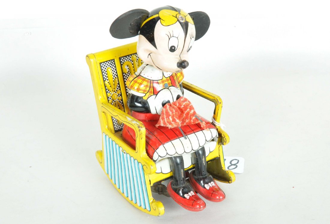 Marx Disney Knitting Minnie Mouse: 6" tall litho tin with rubber ears. Mechanism is functional and is clean. Litho shows wear at chair handles, but overall is very presentable and cute vintage Disney toy, C6+